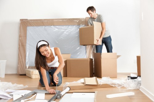 Loading van with household items during a man and van service