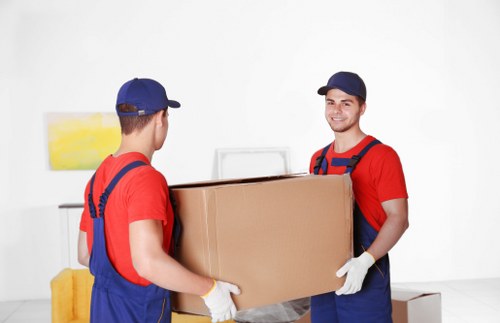 Local removals team planning a move in Brixton street with residential properties