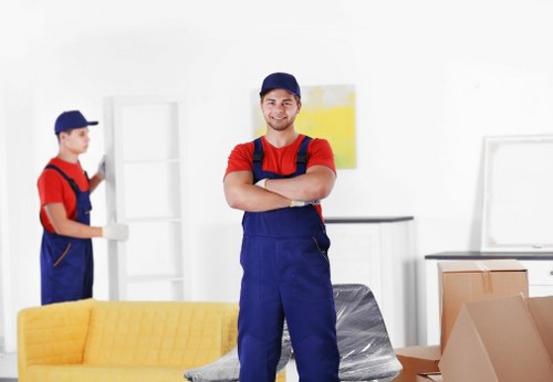 Local house removals planning in Brixton with moving boxes and a van