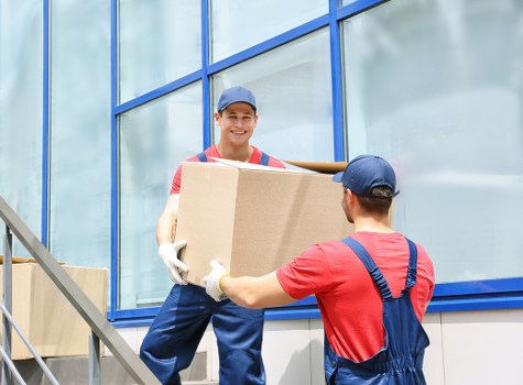 Moving crew handling a flat move on a Brixton street