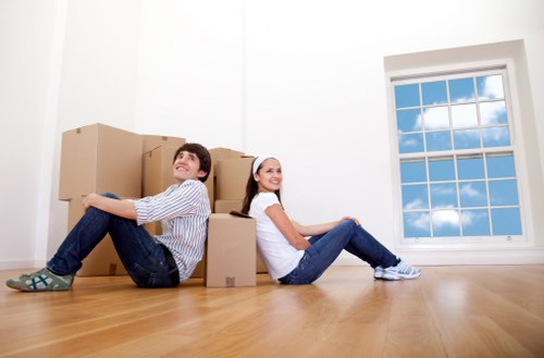 Boxes and furniture arranged inside a Brixton home during relocation