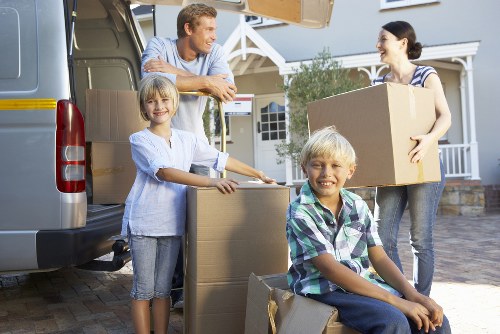 Preparing boxes and furniture for a Brixton moving truck